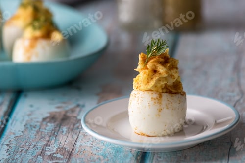 Preview: A Close Up Front View Of Deviled Eggs Ready For Snacking.