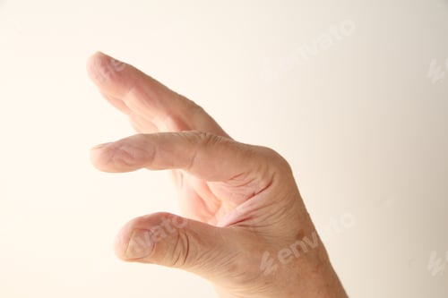 Preview: A Man'S Hand Indicating Smallness Or Largeness