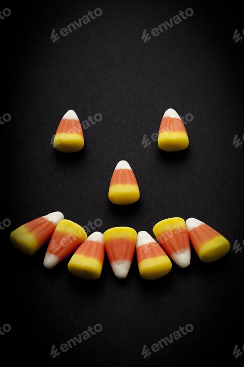 Preview: Smiling Face Formed By Arranging Candy Corns.