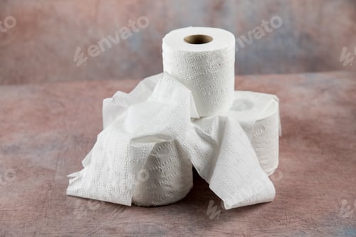 Preview: Rolls Of Soft Toilet Paper On A Dusty Pink Cloth Background