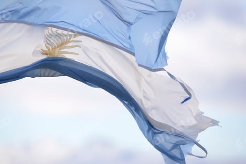 Preview: Waving Flag Against Pale Blue Sky