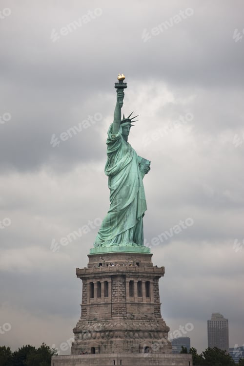Preview: View Of Statue Of Liberty With Storm Clouds In Background.