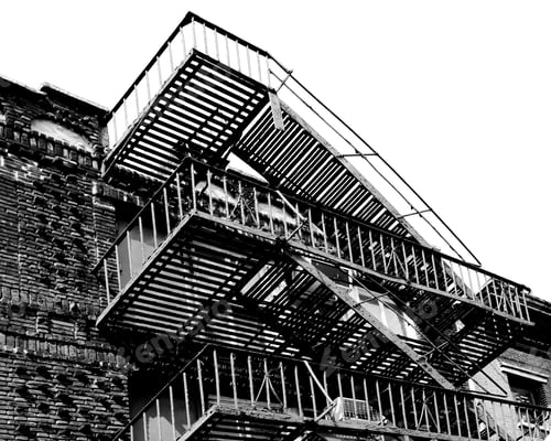 Preview: Looking Up At Metal Fire Escape Stairs And Balconies On An Old Brick Building