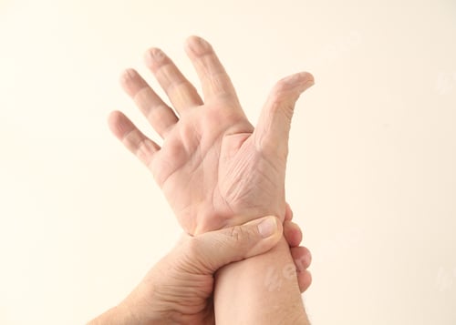 Preview: A Man Grips His Painful Wrist