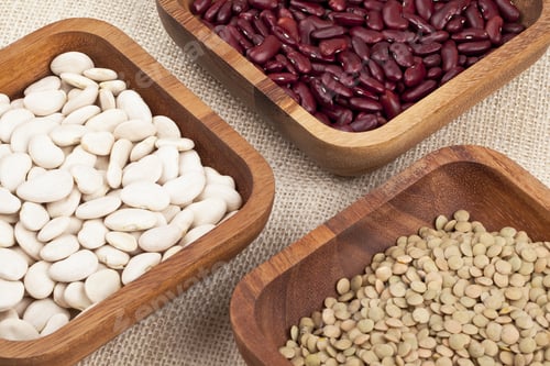 Preview: Close Up Image Of Three Different Beans In Wooden Bowl