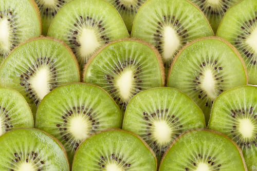 Preview: Close Up Image Of Heap Slices Of Kiwi Fruits