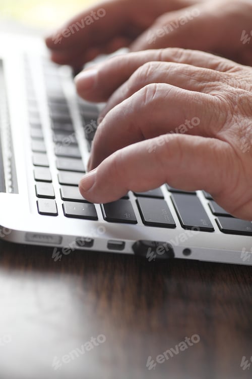 Preview: Senior Man Using A Laptop With Copy Space