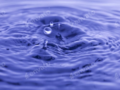 Preview: Water Drop Falling Into Blue Water Abstract Background