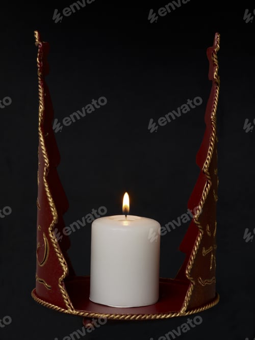 Preview: Close-Up Image Of A Red Vintage Candle Holder With Lighted Candle On A Dark Background