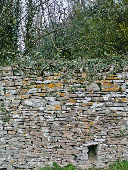 Preview: A Layered Stone Wall With A Hole At The Bottom