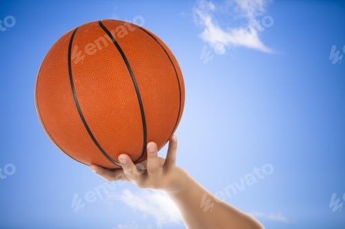 Preview: Hand Holding A Basketball With Sky Background