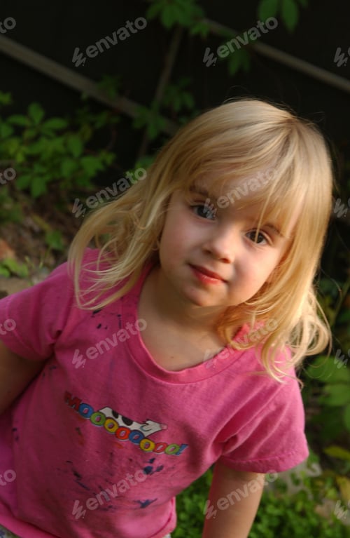 Preview: Young Girl Standing Outdoors Looking At Camera,