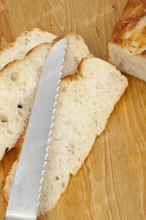 Preview: Cropped Image Of A Bread Knife Used To Slice The Bread