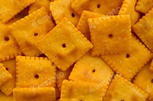 Preview: A Close View Of Cheese Crackers Illuminated With Natural Light.