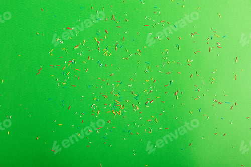 Preview: Colorful Sprinkles On A Green Background