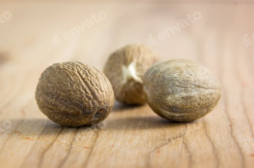 Preview: Nutmegs On A Wood Background