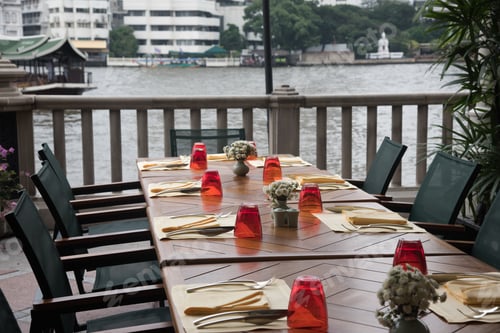 Preview: Colorful Tables Set At The River Edge Cafe By Grand Canal In Bangkok, Thailand