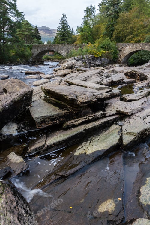 Preview: Beautiful Dochart Falls In Killin Scotland With Lots Of Rocks And Low Flow In The River In Autumn