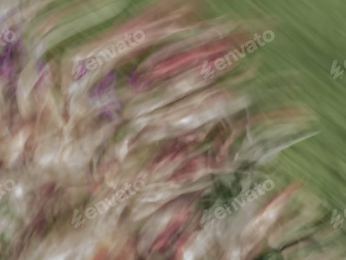 Preview: Abstract Blurred Background Of Pink And Purple Flowers And Leaves On Green.