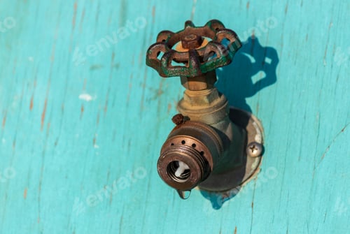 Preview: Old Faucets Spigots In Blue Turquoise Painted Plywood No Hose No Water Selective Focus