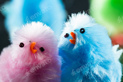 Preview: Close Up Of A Group Of Fuzzy Chicks In Pastel Colors For A Spring Concept On A Dark Background
