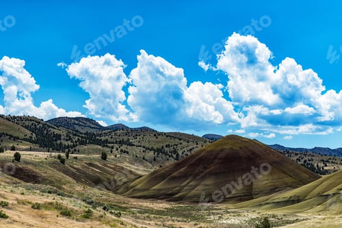 Preview: Amazing Nature Wonder Land In Oregon - Part Of Painted Hills View With Blue Sky And Big Clouds