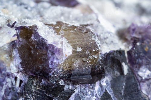 Preview: Close Up Of A Beutiful Piece Of Crystal With Dark Purples And Yellow With Clear Sections