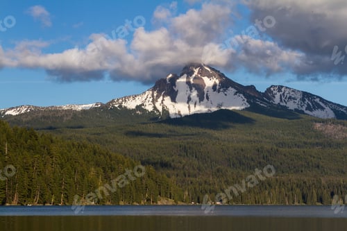 Preview: View Of Mount Thielsen In Oregon With Clouds And Fog Surrounding The Peak