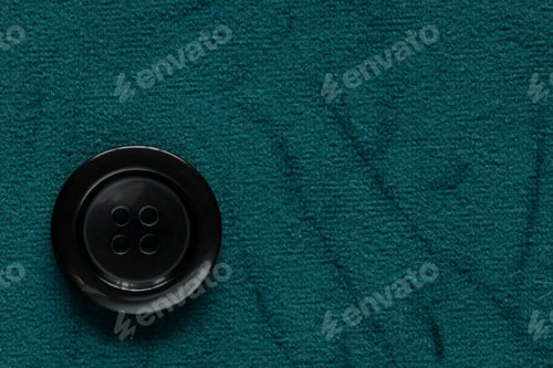 Preview: Clothes Sewing Button On A Blue Green Fabric Swatch Background