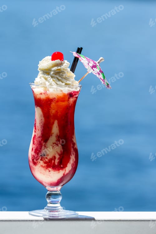 Preview: Refreshing Pina Colada Served With Blended Berries As A Garnish And Topped With Whipped Cream With