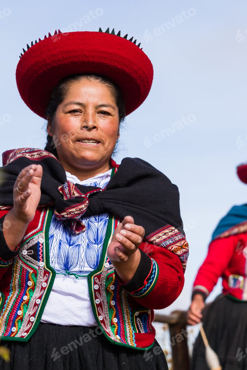 Preview: Chinchero Peru -May 18 : Native Cusquena Woman Dressed In Traditional Colorful Clothing Welcoming