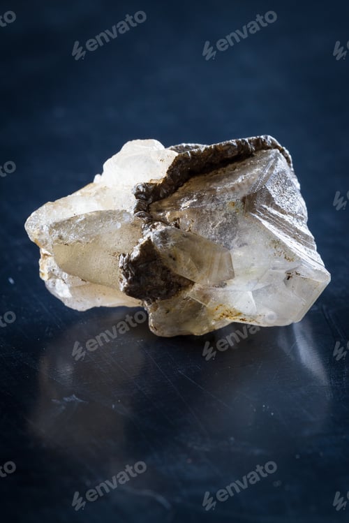 Preview: Close Up Of A Small Quartz Crystal With A And Of Silver Growing Around It