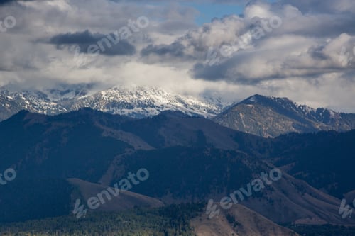 Preview: Snow Capped Mountain With Clouds Above