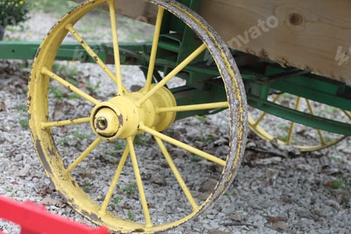 Preview: A Closeup Of A Round Yellow Wagon Wheel And Spokes. 2801