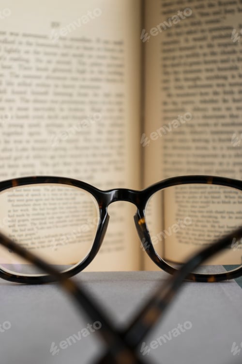Preview: Reading Glasses on a Book in Natural Light
