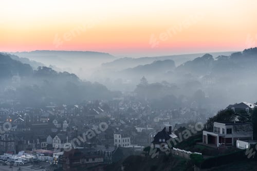 Preview: Landscape Photo Of A Small Town Covered In Fog And Mist Coming From The Mountains And Ocean With A