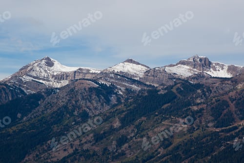 Preview: Rugged Mountains With Clouds In The Sky