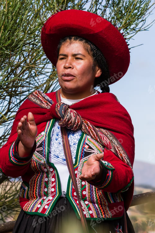 Preview: Chinchero Peru -May 18 : Native Cusquena Woman Dressed In Traditional Colorful Clothing Welcoming