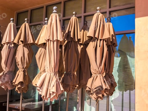 Preview: Group Of Closed Brown Sun Umbrellas