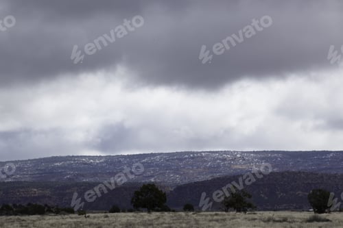Preview: Landscape Of Rough Mountains Encased By Low Hanging Clouds, From Southern Utah, Usa