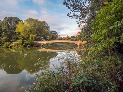 Preview: The Bow Bridge Is A Cast Iron Bridge Located In Central Park, New York City, Crossing Over The Lake