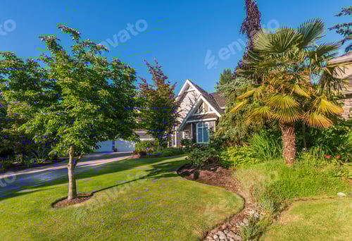 Preview: Beautiful Exterior Of Newly Built Luxury Home. Yard With Green Grass And Walkway Lead To Front