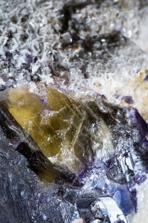 Preview: Close Up Of A Beutiful Piece Of Crystal With Dark Purples And Yellow With Clear Sections