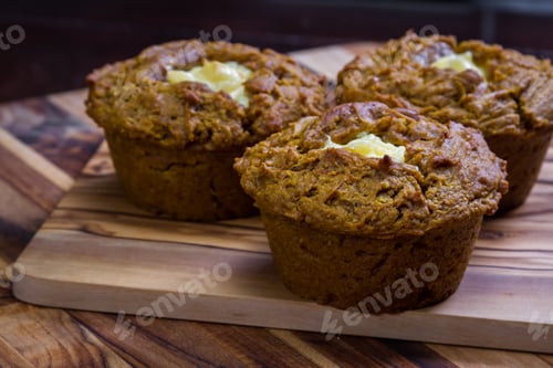 Preview: Close Up Of A Home Made Pumpkin Muffin On A Wooden Background