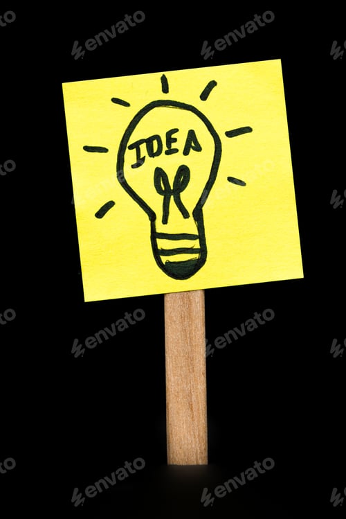 Preview: Concept Image For A Good Idea Using A Sticky Note Over A Black Background