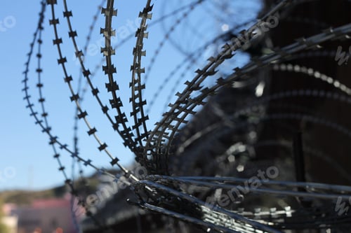 Preview: Large Loops Of Sharp Razor Wire Hang On Bollard Style Border Wall At The Us-Mexico Border 5069