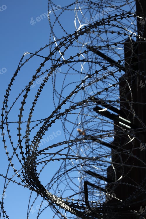 Preview: Large Loops Of Sharp Razor Wire Hang On Bollard Style Border Wall At The Us-Mexico Border 5061