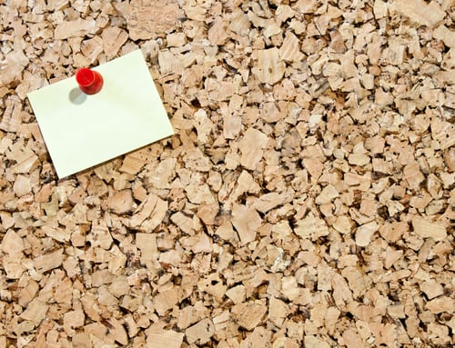 Preview: Blank Sticky Note Stuck On A Cork Board With A Red Pin