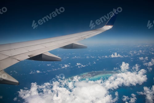 Preview: Airplane Wing Above Ocean And Caribbean Island