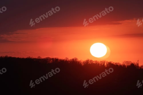 Preview: Colorful Sunset Over The Forest. Sun Hiding Behind Dark Tree Silhouettes. Shot In Barrie, Ontario
